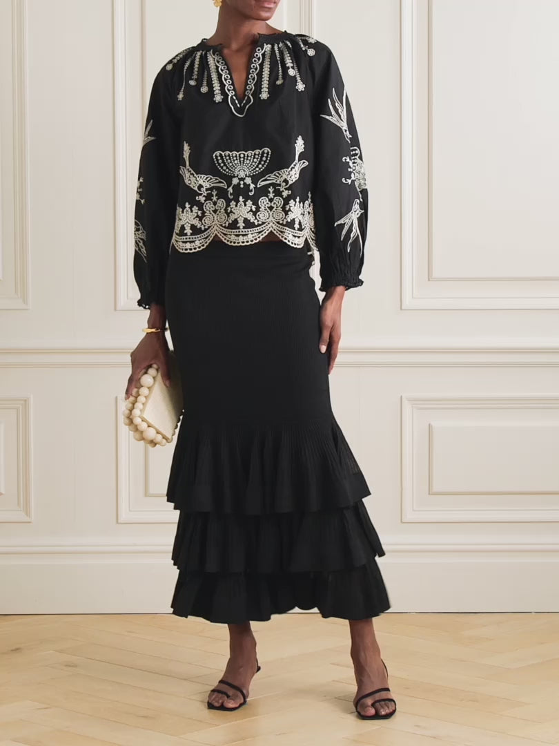 This Kingsley embroidered cotton-poplin blouse by SEA combines delicate craftsmanship with effortless style. Crafted from soft cotton-poplin, it features charming floral and bird embroidery alongside elegant swirling patterns. The loose fit enhances comfort, while scalloped edges and crocheted trims along the notched neckline add a touch of refined detail. Perfect for elevating any outfit with graceful ease.