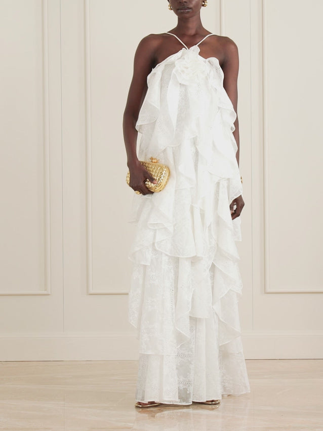Aje's Merritt dress captures an ethereal elegance with its cascading ruffles of broderie anglaise. Delicate spaghetti straps provide understated support while the voluminous maxi skirt flows with effortless grace. The intricate cutwork detailing and layered construction create movement and dimension with every step. Style with metallic accessories to enhance its romantic, refined aesthetic.