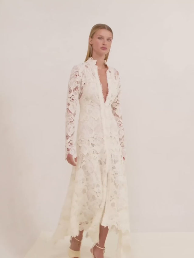 Timeless yet modern, the Camila Dress balances elegance with contemporary style. Cut as a midi with long sleeves, this piece showcases delicate floral lace throughout for a romantic, feminine look. The plunging neckline offers a flattering, sophisticated edge that elevates any occasion.
