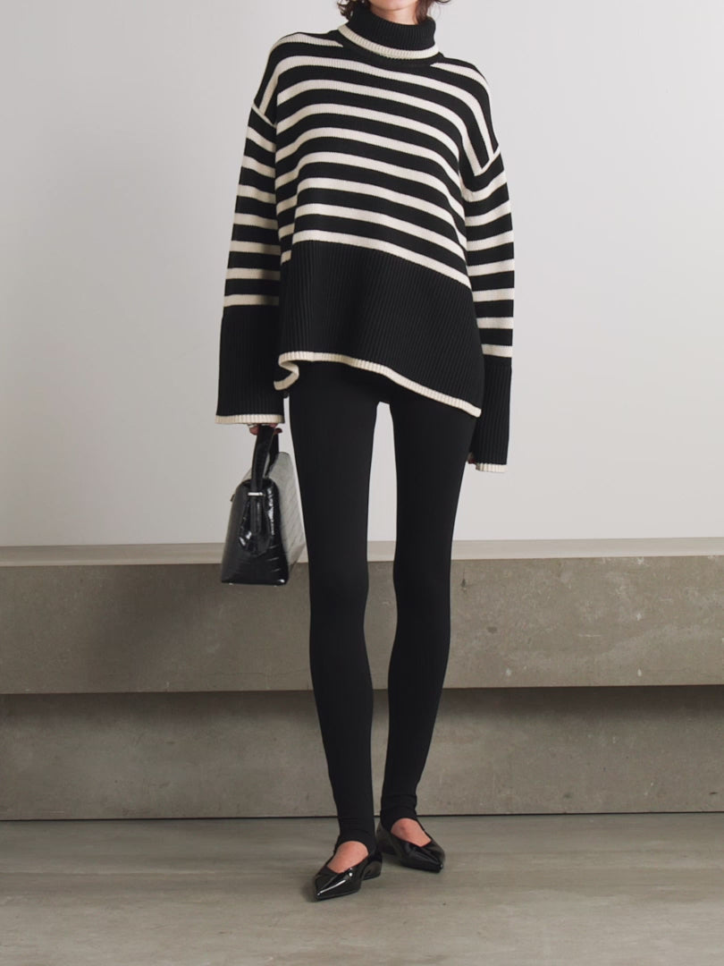 This striped wool-blend turtleneck sweater from TOTEME combines timeless style with cozy comfort. Crafted from a soft blend of wool and organic cotton, it features a relaxed fit and a classic turtleneck, making it perfect for layering. The iconic stripes add a refined touch, while the breathable fabric ensures warmth without bulk. Pair it with tailored pants for an effortlessly polished look that lasts season after season.