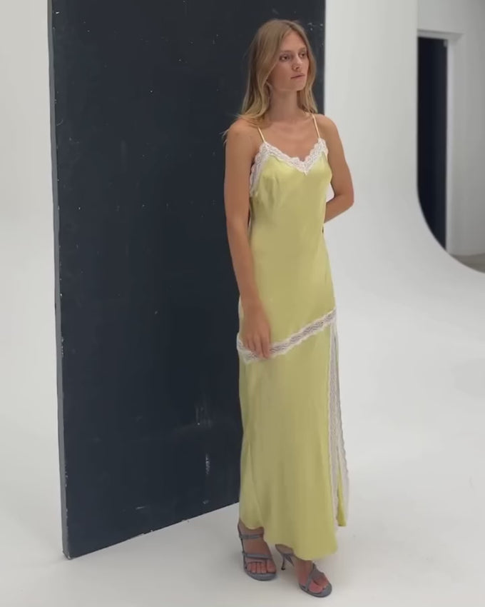 The Sevin Lace Trim Slip Dress embodies understated elegance with its refined silhouette and delicate lace detailing. Expertly cut on the bias, the fabric drapes naturally against the body for a fluid, effortless fit. Sheer contrast lace adorns the neckline, hem, and asymmetric thigh split, adding a touch of sophistication to this maxi slip dress. Perfect for evening occasions or layered styling, this piece transitions seamlessly from day to night.