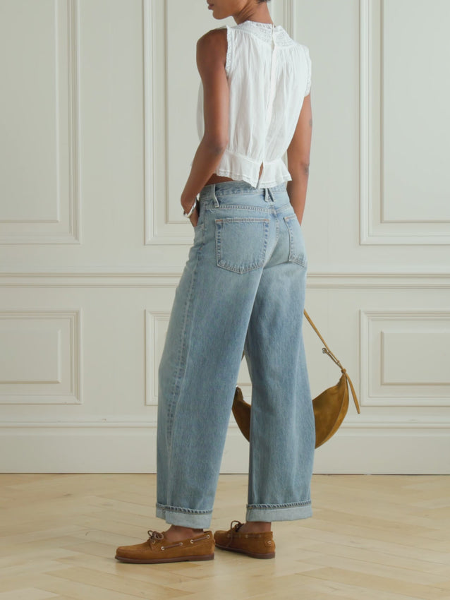 The Lilibet Top by Doen is a charming piece that celebrates thoughtful design. Crafted from soft organic cotton-voile, this relaxed silhouette features delicate lace trims and intricate pintucking that catch the eye. A cinched waist creates a subtle peplum hem, adding movement and dimension to the shape. Available in classic black and beyond, it's the kind of top that feels effortless to wear while looking anything but ordinary.