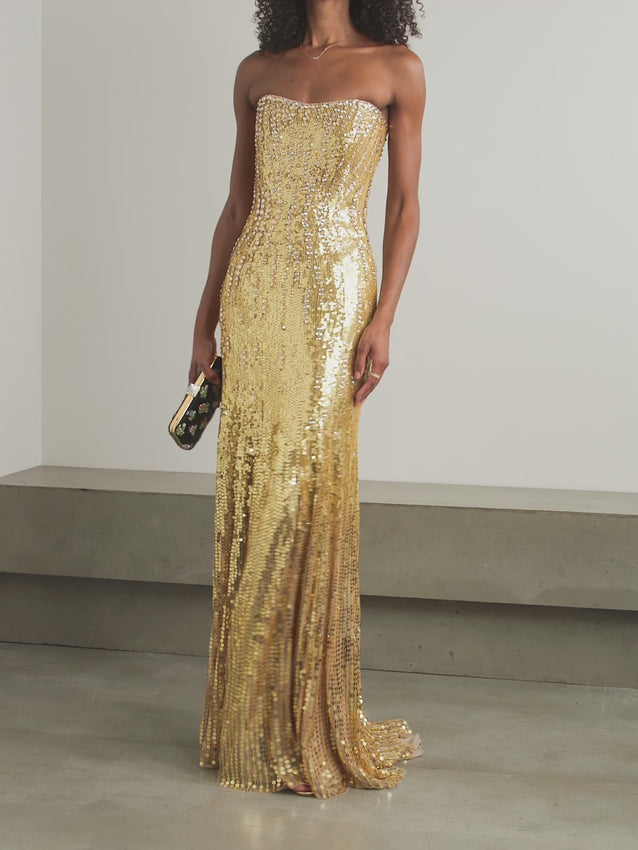 Slip into pure magic with the Sarai strapless sequined tulle gown—where elegance meets enchantment. This showstopping gown features shimmering sequins that catch the light with every twirl, draped in the softest tulle for an ethereal silhouette. The strapless neckline offers timeless sophistication, while the intricate beadwork ensures you'll be the most dazzling guest in the room. Perfect for galas, weddings, or any occasion that calls for a touch of glamour. Prepare to turn heads and steal hearts.