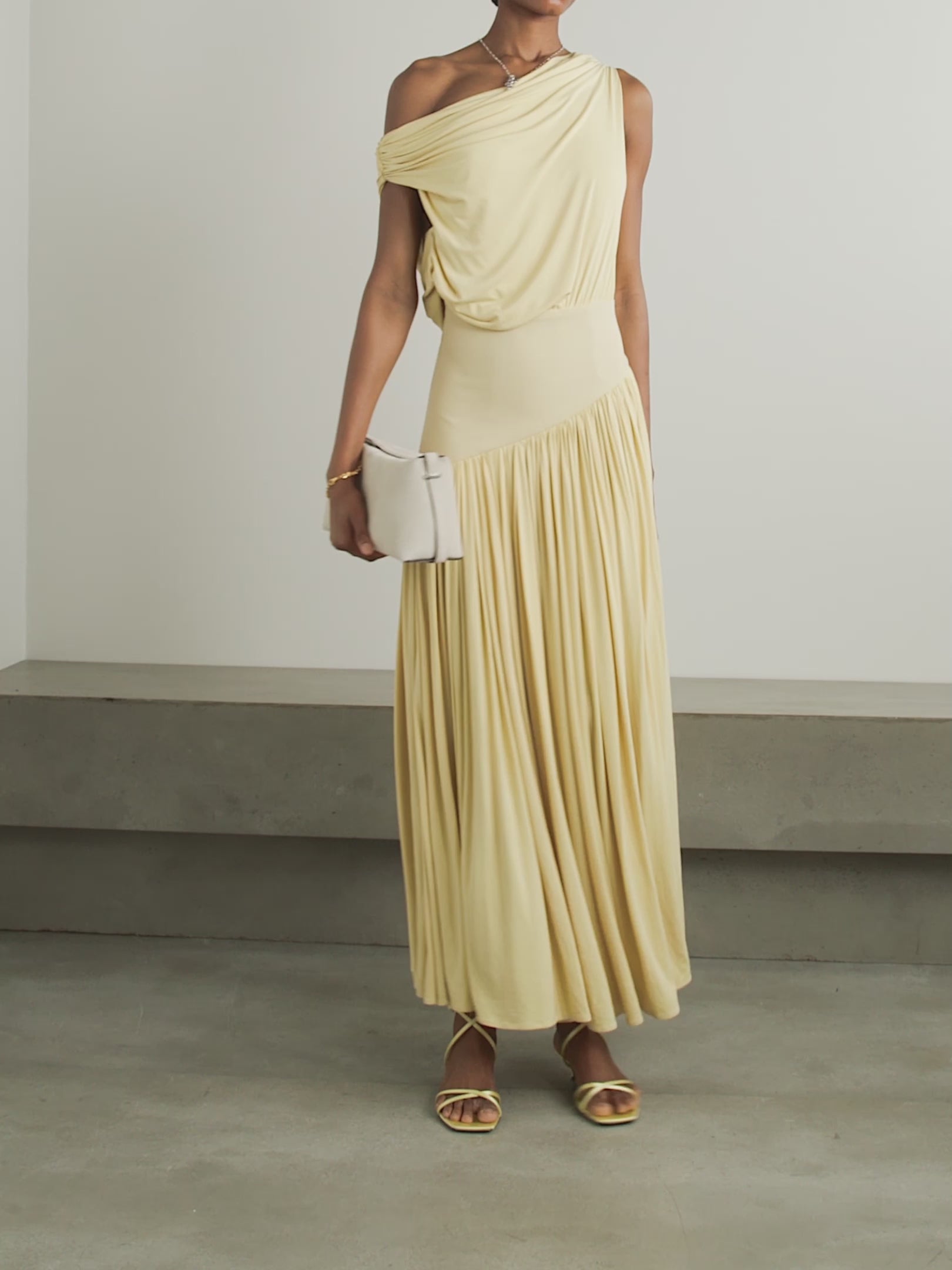 Discover effortless elegance with the Gwen Asymmetric Draped Jersey Dress by Abadia. Crafted from luxuriously soft stretch-bamboo fabric, this stunning piece features a sophisticated one-shoulder design that flatters every frame. Artfully draped details flow gracefully from the fitted top through the skirt, creating a silhouette that's both modern and timelessly chic. 