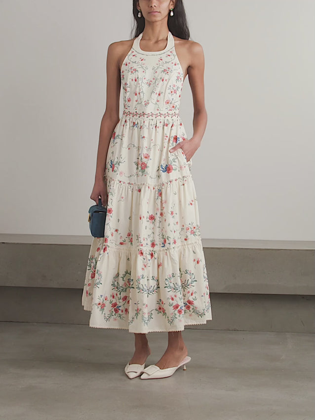 Crafted from breathable linen, the Consuelo Mosqueta Midi Dress from Agua by Agua Bendita features delicate embroidery of elegant blooms that enhance its refined aesthetic. Its flowing tiers offer effortless movement and a flattering silhouette, combining comfort with expert design that suits both casual and sophisticated occasions.