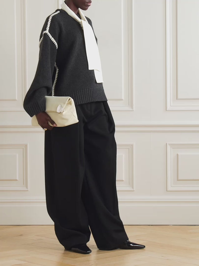Elevate your wardrobe with this oversized sweater by Toteme crafted from a sumptuous wool and cashmere blend. Its relaxed fit with dropped shoulders offers effortless comfort, while the contrasting cream embroidery adds a refined, distinctive touch. Designed as a timeless staple, it seamlessly enriches your collection, providing both warmth and style for any occasion.