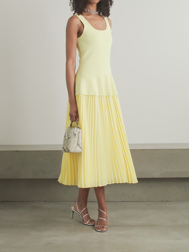 Effortless elegance meets modern sophistication in the Allana midi dress. Crafted from luxurious pleated georgette paired with structured ribbed-knit detailing, this piece transitions seamlessly from day to evening. The midi silhouette flatters every frame while the thoughtful fabric combination creates dynamic movement and visual interest. Perfect for those who appreciate refined, versatile pieces that work as hard as you do.