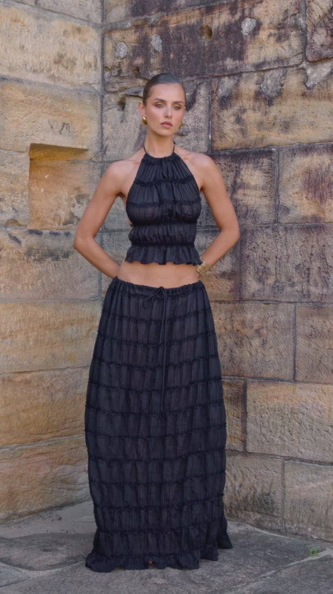 The Juliette skirt merges timeless elegance with modern versatility. This voluminous maxi features romantic ruched detailing and delicate piped lace throughout. Thanks to its adjustable drawstring waist, wear it as a stunning skirt or transform it into a graceful flowing dress with an alluring low back. Pair with the Juliette halter top for a coordinated look that turns heads. Sheer and sophisticated, this piece is an essential addition to any fashion-forward wardrobe.