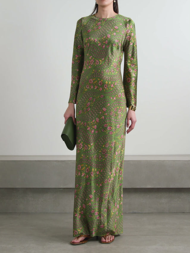 The Gemma dress captures effortless elegance with its romantic floral print, where curved strands of flowers dance across the fabric to evoke a billowy, wind-swept aesthetic. Crafted from luxurious silk-blend satin, this maxi dress features a figure-skimming silhouette that flatters while maintaining graceful movement. Finished with elegant flared cuffs, it's a sophisticated choice for special occasions or elevated everyday wear.