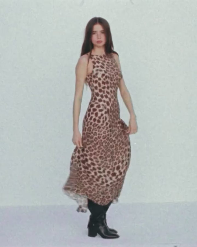 A timeless bias-cut midi dress that glides gracefully with every movement. The Romy features a sophisticated high neckline, elegantly draped skirt, and sculpted back with refined V-shaped hip detailing. Slip-on style with a fully lined interior for comfort and ease. Effortlessly chic and endlessly versatile—a wardrobe essential you'll reach for again and again.