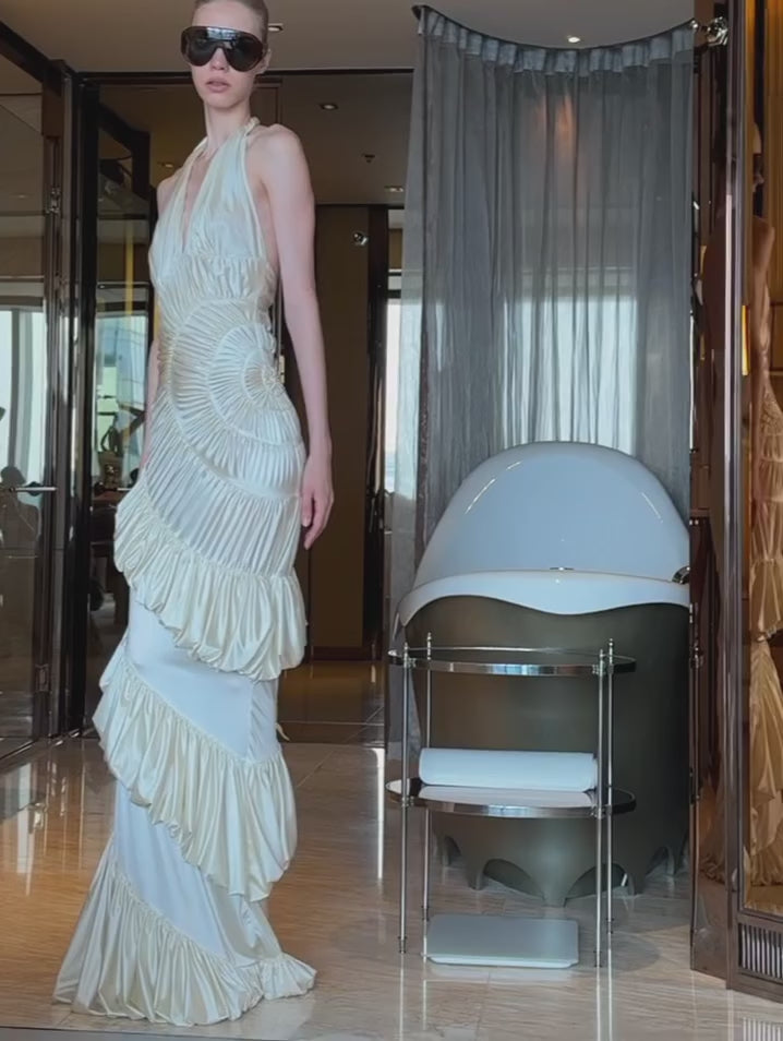 The Ammonite Gown by Datt combines elegance with practical comfort. Crafted from soft mesh that drapes beautifully against your skin, this fitted piece features a convenient side zip for effortless dressing. The included separate bikini lining ensures you're covered and confident underneath, making this gown versatile enough for any occasion where you want to feel polished and put-together.