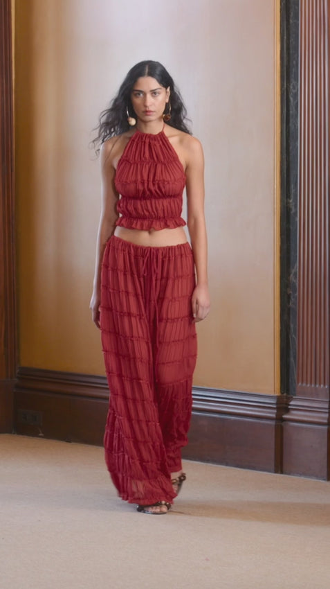 Introducing the Juliette skirt, a seamless blend of versatility and vintage charm. Featuring a voluminous maxi skirt with ruched detail and delicately piped lace. Juliette is a fashion-forward essential, her drawstring waist allows you to wear her as a skirt, or make a flattering flowing dress with a sweeping low back. For a striking coordinating set, style the maxi with our Juliette halter top. Elegantly sheer in finish, she's a stylish must-have that will leave a lasting impression.