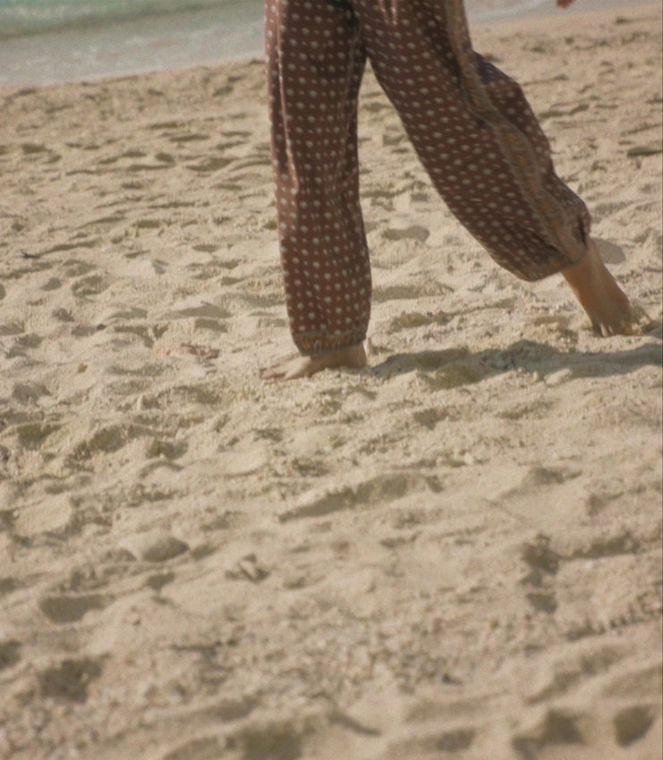 Discover effortless style with the Yarrow Pant, designed with a generous balloon silhouette and luxurious soft volume. Made from comfortable midweight cotton, it showcases our signature nautical Foulard de la Mer print. The relaxed elasticated waist and cuffs ensure all-day ease, while decorative placed borders accent the side seams, leg openings, and waistline for a polished finish.