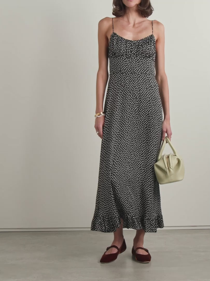 DÔEN's Rosaria midi dress elegantly combines form and detail with its polka-dot silk-blend fabric. Designed with precisely placed panels, it accentuates the silhouette by creating a subtle 'V' shape at the waist, enhancing your natural curves. The gathered bust paired with delicate pin-thin shoulder straps offers refined support while the ruffled hem adds graceful movement, making it a sophisticated choice for any occasion.