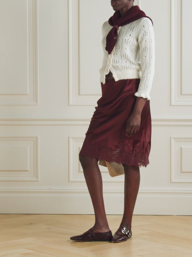 The Elowette Skirt captures timeless romance with its graceful silhouette and refined details. Crafted from luxurious silk, this piece features delicate lace trimming that cascades from the hem, creating an effortlessly elegant movement. The cafe brun hue offers a warm, versatile neutral that pairs beautifully with ballet flats for an understated, sophisticated look. Perfect for those who appreciate vintage-inspired design with a modern sensibility.