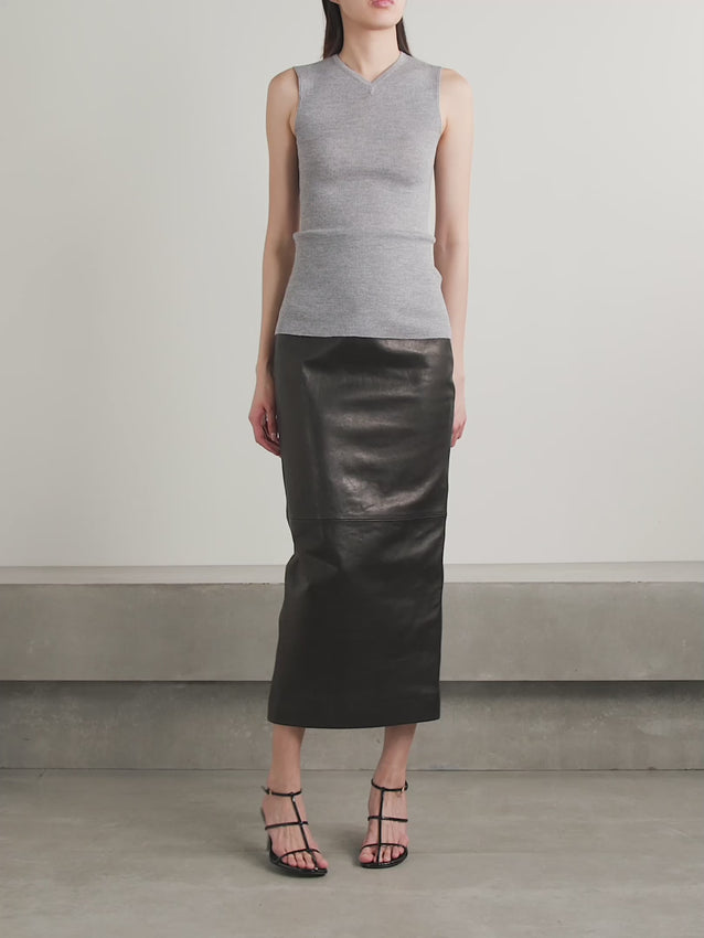 Elevate your style with KHAITE's Loxley leather midi skirt, designed with a sleek column silhouette that exudes sophistication. Crafted from luxurious leather, it features a darted waist for a flattering fit and an ankle-grazing hem with a subtle back slit for effortless movement. The satin-twill lining ensures a smooth, comfortable wear that won’t cling. Perfect for making a polished statement, this skirt blends runway elegance with everyday confidence.