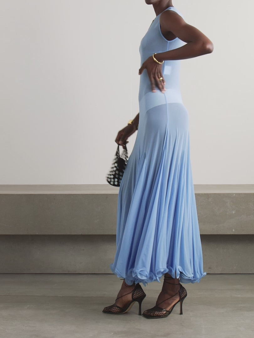 This Pleated Jersey Maxi Dress embodies Magda Butrym's signature style, with unexpected fabrics and unconventional details. The lightweight jersey fabric gracefully drapes over your body, while the artful pleating on the skirt adds a touch of elegance. Keep the sheer finish in mind when selecting your undergarments. Elevate your wardrobe with this luxury piece.