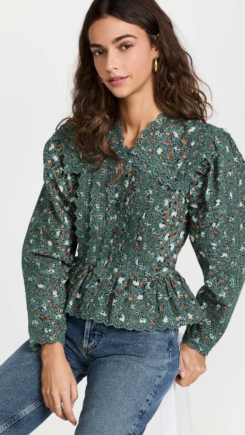 Get ready to turn heads with the Mina Blouse! This gorgeous floral-printed blouse features long, airy sleeves, a stunning large collar, and delicate frilled edges. Perfect for making a statement and adding a touch of romantic flair to any outfit.