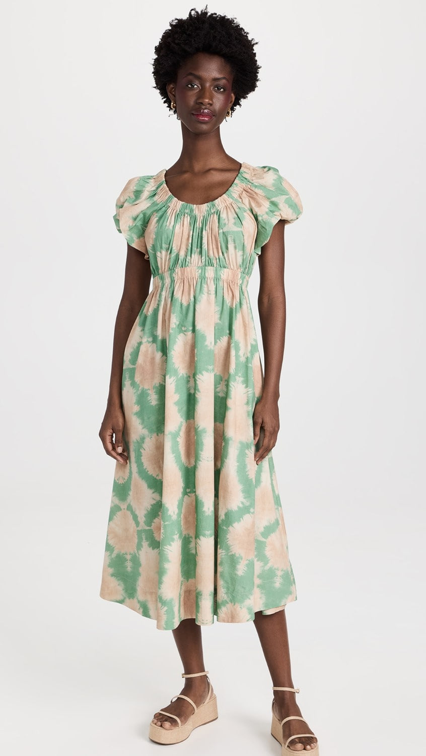 Expertly crafted by Ulla Johnson, the Nanette Poplin Maxi Dress features a symmetrical tie dye print for a modern yet timeless look. With an empire waist and puff sleeves, this dress exudes classic elegance. Pair it with strappy sandals for the perfect summer outfit.