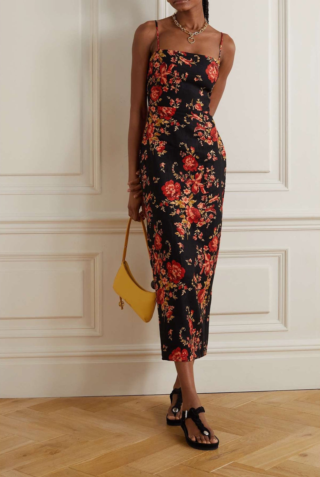 Reformation's 'Frankie' maxi dress is printed with red carnations that bloom beautifully against the black background. Made from linen, it has a square neckline and a smocked panel at the back for comfort. The back slit ensures you can work the room - or dance floor - with ease.