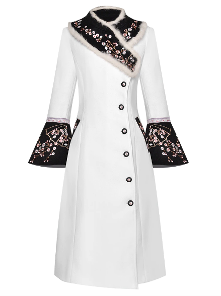 Experience luxury with our designer Veste Erin coat. Made from high-quality wool, this coat is perfect for the winter season. The elegant rabbit fur collar adds a touch of glamour, while the delicate embroidery elevates the overall look. Stay warm and stylish with our overcoat, designed to keep you cozy and chic.