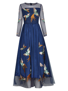 Elevate your style with the Robe Patresha. This high-quality, vintage dress from a top fashion designer features beautiful embroidery of little birds and a mesh long sleeve. Perfect for spring, it effortlessly combines elegance and charm. Upgrade your wardrobe and turn heads wherever you go.