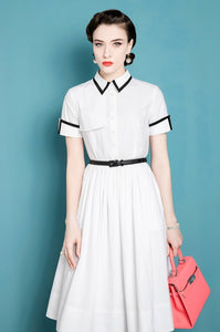 This French Retro Dress exudes a vintage charm, inspired by Audrey Hepburn's iconic style. Made from cotton, its umbrella skirt design and doll collar add a touch of elegance. The perfect dress for a summer day, bringing a classic and timeless look to any wardrobe.