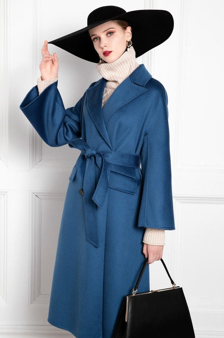 Indulge in luxury with the Manteaux Zoeline cashmere coat for women. Featuring a high-end double-sided water ripple design, this blue waist-cinching coat is perfect for fall and winter. Stay warm and stylish with this must-have piece!