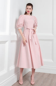 Get ready to turn heads with the Robe Vanity dress. Made with high-end materials, this dress exudes luxury and class. The sweet bubble sleeves add a touch of retro flair, while the umbrella skirt creates a flattering silhouette. Perfect for any summer occasion, this dress is sure to impress with its French-inspired design.