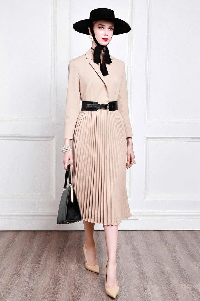 Introducing the Robe Matilda, a luxurious high-end suit dress for banquets and special events. Crafted from brilliant camel fabric, this pleated dress is perfect for the colder seasons, exuding European and American charm. A timeless statement piece that will always make a lasting impression.
