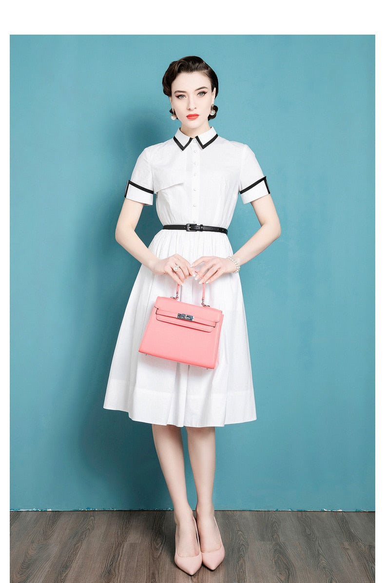 This French Retro Dress exudes a vintage charm, inspired by Audrey Hepburn's iconic style. Made from cotton, its umbrella skirt design and doll collar add a touch of elegance. The perfect dress for a summer day, bringing a classic and timeless look to any wardrobe.