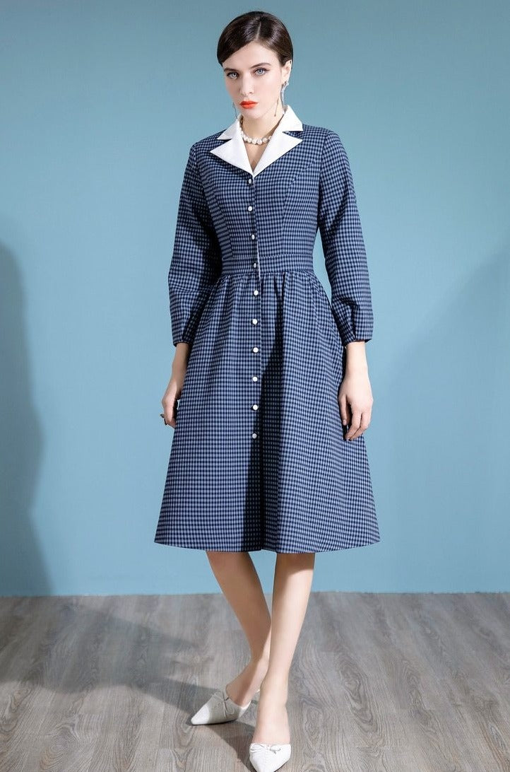 Elevate your wardrobe with the Robe Coretta. This premium dress exudes sophistication and exclusivity with its high-end suit design, perfect for the fall season. The elegant midi swing skirt and lantern sleeves add a touch of temperament to any woman's ensemble.