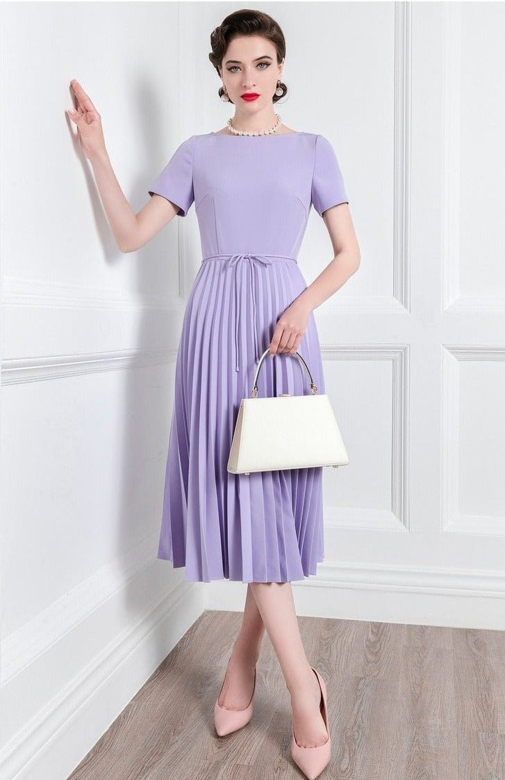 Introducing the Robe Louise - a high-end, pleated skirt with a fitted short-sleeved bodice, perfect for channeling your inner goddess this summer. Embrace the latest fashion in comfort and style.