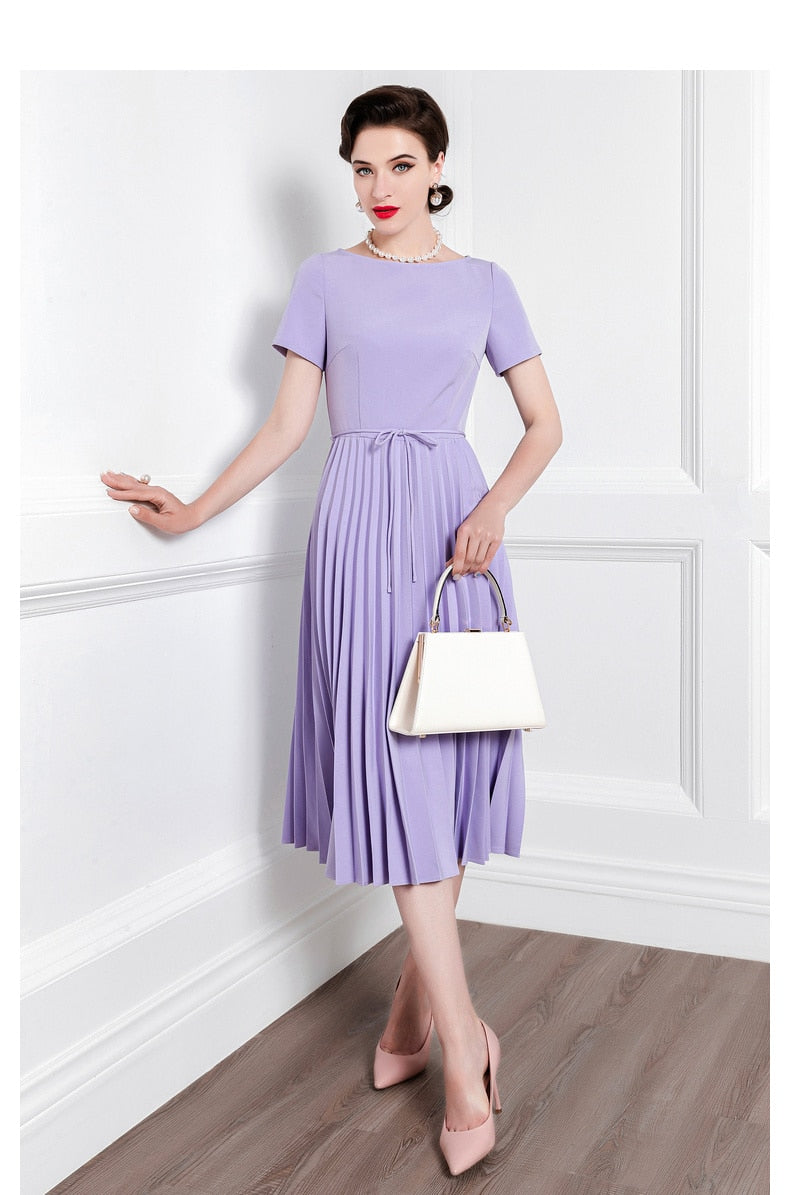 Introducing the Robe Louise - a high-end, pleated skirt with a fitted short-sleeved bodice, perfect for channeling your inner goddess this summer. Embrace the latest fashion in comfort and style.
