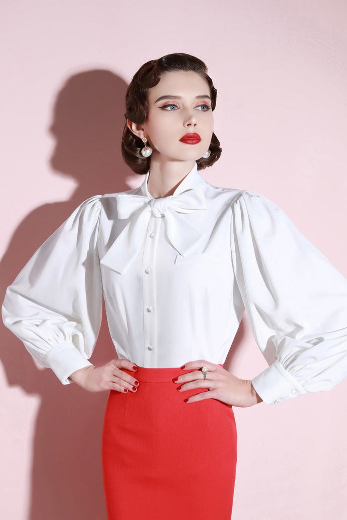 Elevate your wardrobe with our Blouse Sabrine. This high-end shirt boasts a small foreign style with a retro temperament. The white lantern sleeves add a touch of fashion to any outfit. Experience the perfect blend of design and sophistication.