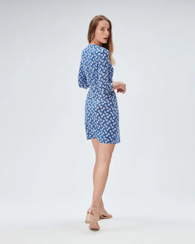 Indulge in the elegant French fashion with our Robe Octavia. This personalized dress features a unique split mid length design and original print that exudes sophistication and style. Perfect for any occasion, this dress will make you stand out from the crowd. Be bold, be fashionable, be Octavia!