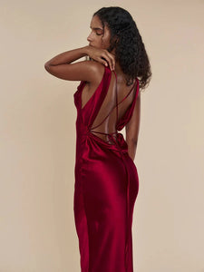 This satin backless bandage dress features spaghetti straps and a v-neck design, making it a sexy and stylish choice for any occasion. The maxi length adds an elegant touch, while the bandage material provides a flattering fit. Perfect for making a statement at any event.