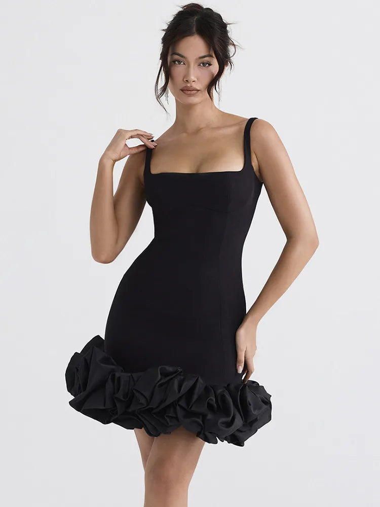 Step out in style with our Mini robe Mirabel. This elegant black dress is perfect for any occasion, with its sexy backless design and sleek spaghetti straps. The bodycon fit will enhance your curves, making you the star of any party. Don't miss out on this must-have dress for your wardrobe.