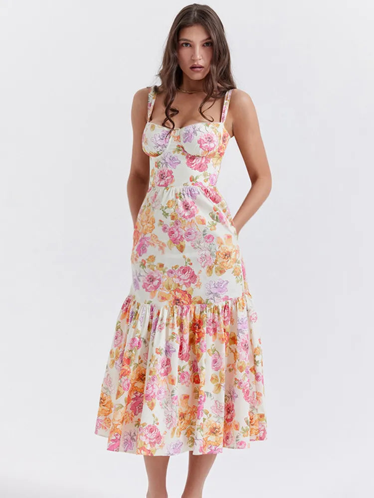 Introducing the Robe Dannica - a perfect summer dress for women. With its vibrant floral print, spaghetti straps, and pleated A-line silhouette, this dress is both stylish and sexy. The sleeveless and backless design adds an element of playfulness to its already flirty look. Get ready to turn heads in this printed midi dress!