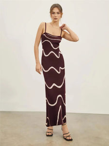 Achieve a bold and elegant look with our Dress Valentia. Featuring zebra stripes, a high waist design, and a backless cut, this knitted dress is perfect for any occasion. Its slim fit and long length will make you stand out at a street party or club gathering. Elevate your style with this versatile and chic maxi dress.