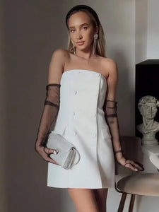 Indulge in luxury with our Robe Ariella. This elegant off-shoulder white dress boasts a slimming double-breasted design and a high waist, perfect for showing off your curves. Made for the stylish woman, it is versatile for both evening events and high-class parties. Elevate your wardrobe with this exclusive dress.