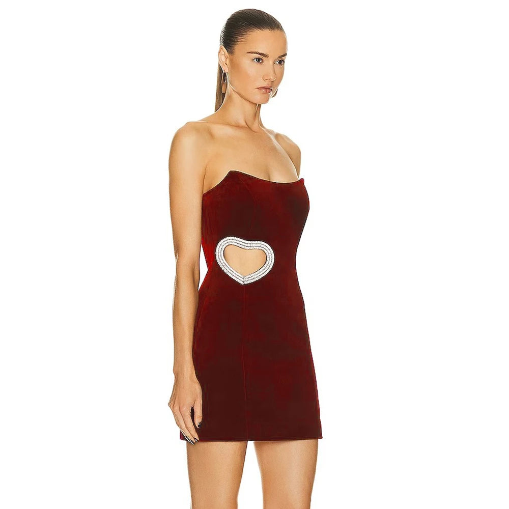 Get ready to rock the party in our Winered Color Dress Marine! This bodycon mini bandage dress will hug your curves in all the right places. With a strapless design, it's perfect for a fun and flirty night out. Celebrate in style with this cute and versatile dress. Available for wholesale orders.