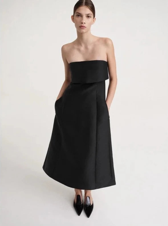 Introducing the Robe Delilah - the perfect addition to any wardrobe. Made with premium wool, this dress features a bralette top and A-line design for a flattering silhouette. With its elegant style, it's a must-have for any special occasion or night out. Elevate your look with this sexy and sophisticated maxi dress.