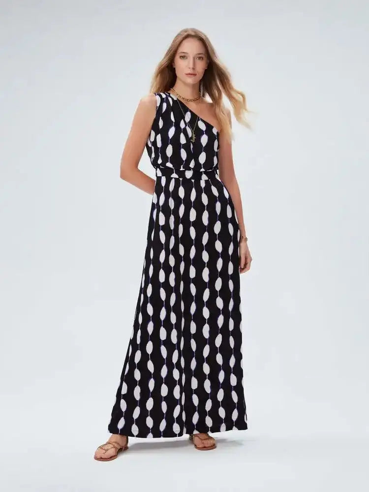 Elevate your style with our French Style Fashion Dress by DVF. This one-shoulder, mid-length dress features a unique abstract print, adding a personalized touch to your wardrobe. Stand out from the crowd and make a statement with this original and stylish dress.