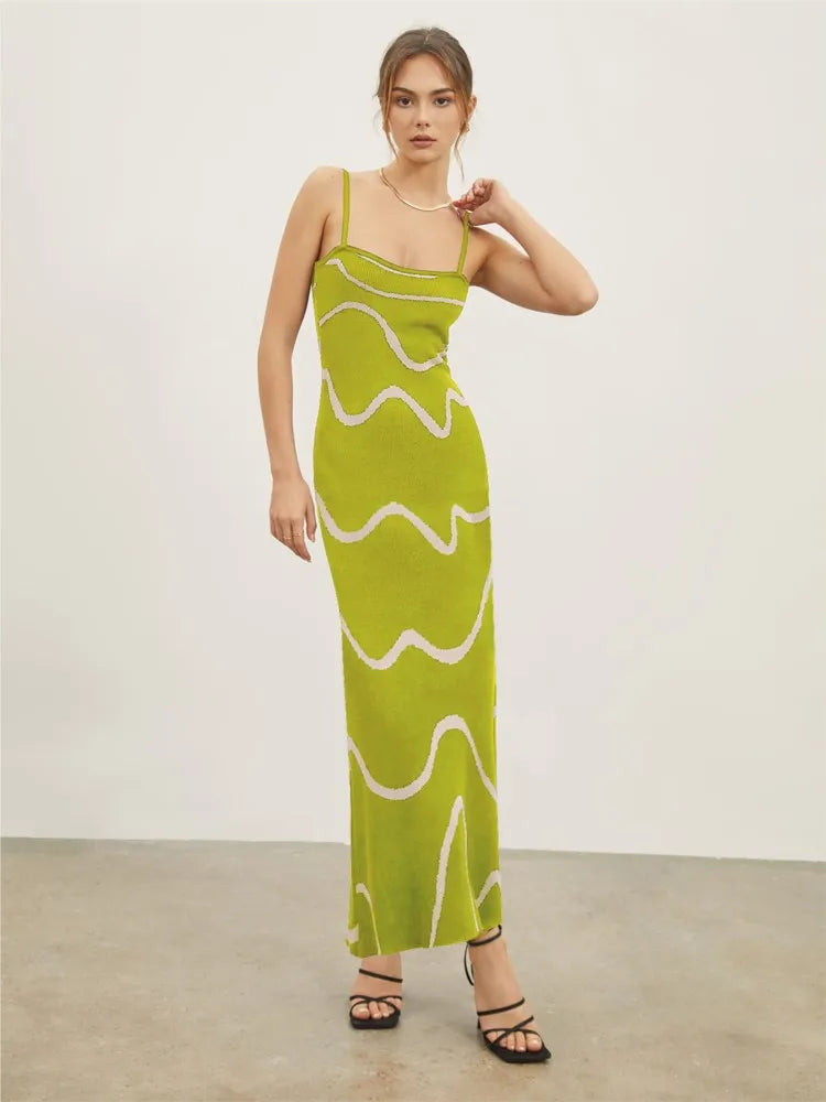 Achieve a bold and elegant look with our Dress Valentia. Featuring zebra stripes, a high waist design, and a backless cut, this knitted dress is perfect for any occasion. Its slim fit and long length will make you stand out at a street party or club gathering. Elevate your style with this versatile and chic maxi dress.