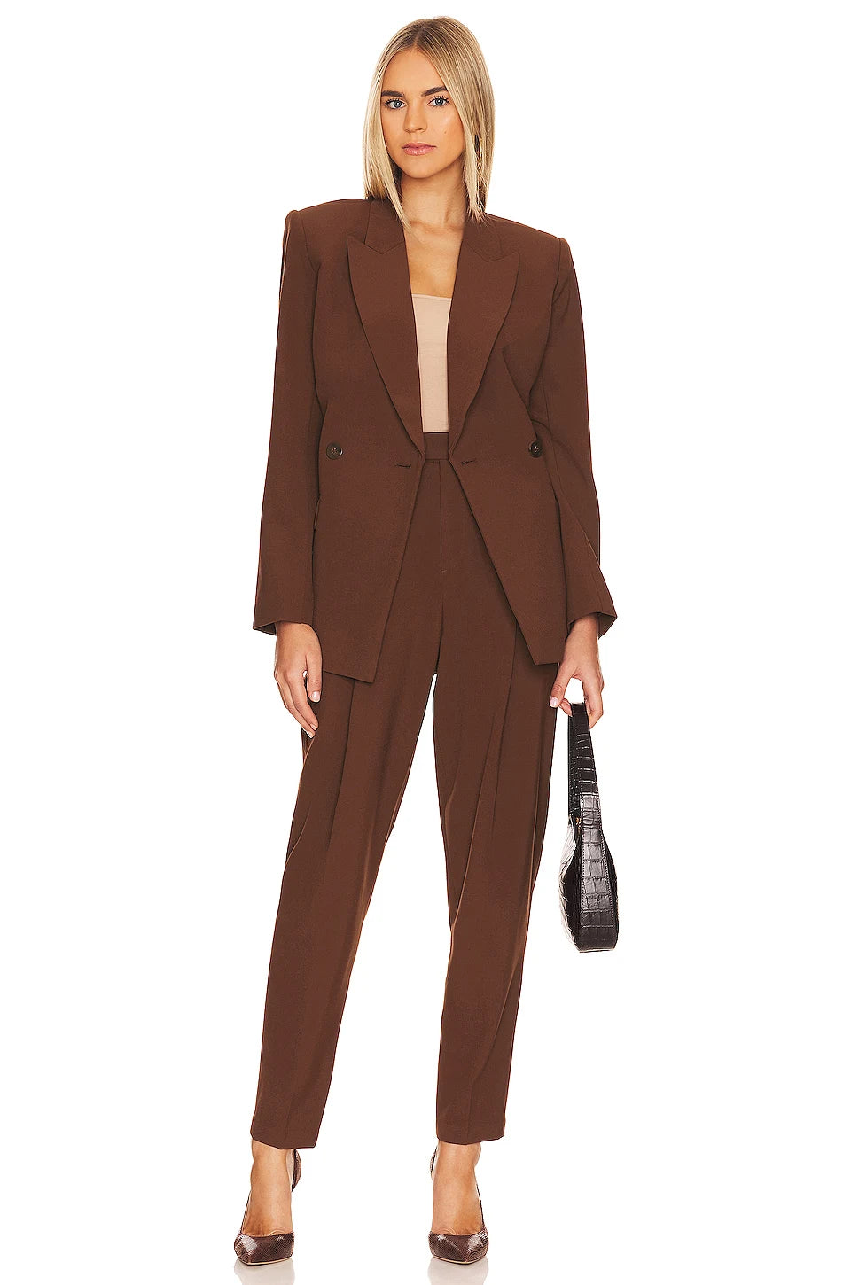 Brave the business world in style with the Ensemble Helene! This two-piece set offers a modern twist on the classic business suit with its neutral tones and sharp lines. Perfect for the bold, brave commuter who loves to take risks! Let your style do the talking with Ensemble Helene.