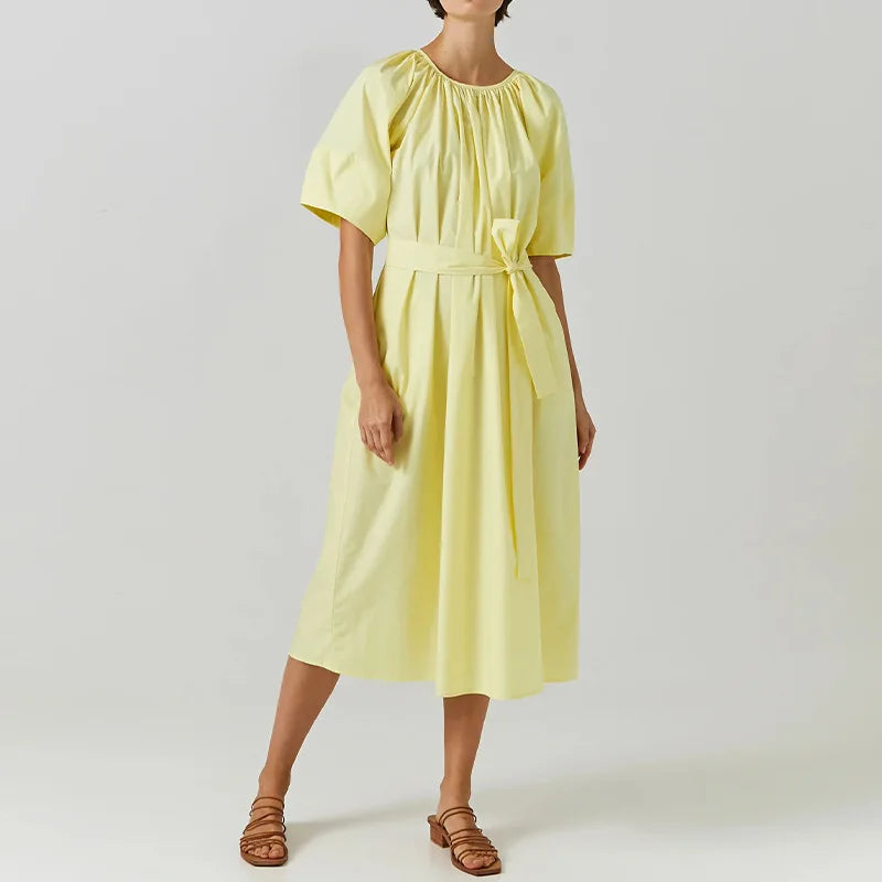 Upgrade your wardrobe with our Dress Elaina. Made from high-quality cotton, this elegant dress features ruched detailing and French style lantern sleeves, perfect for any party. Stay comfortable and stylish all day long.