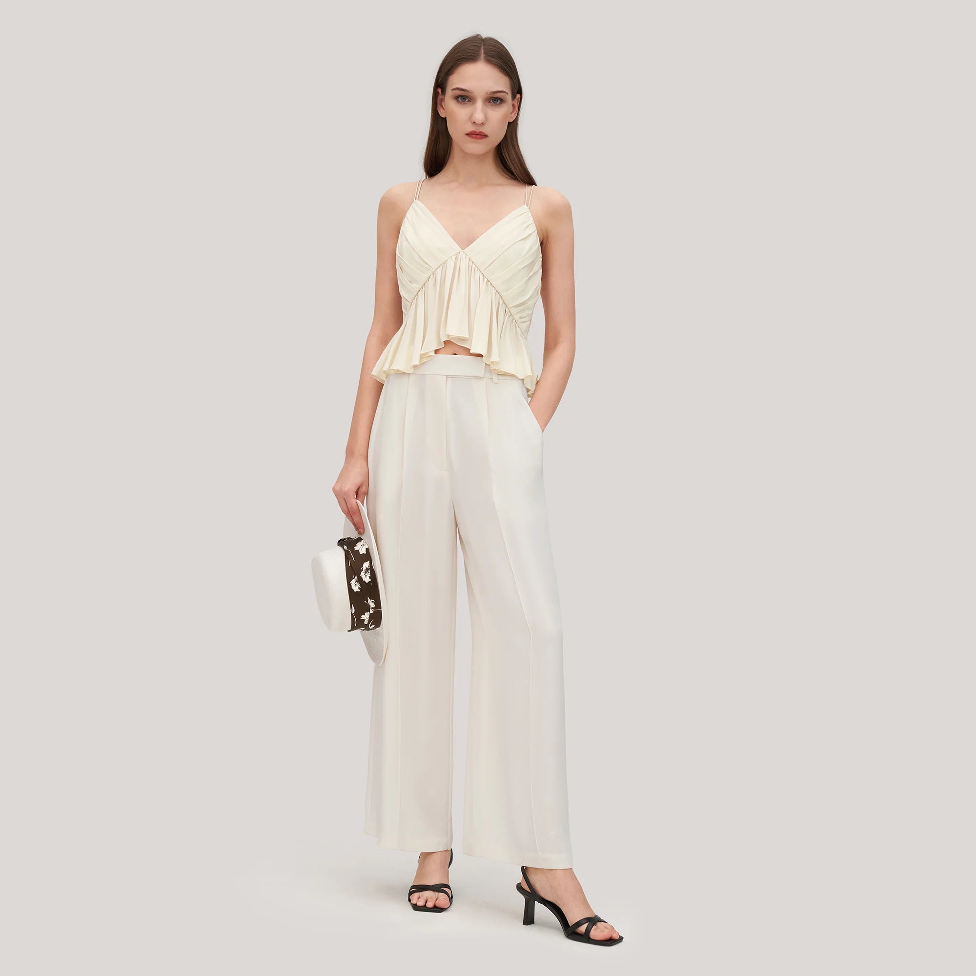 Crafted from Crepe Silk, the Tatiana Ensemble features a statement pair of contemporary pants, with a high waist and pocket design, creating a perfect silhouette of effortless elegance. The designers perfect balance of structure and fluidity makes this an exclusive piece for the fashionably elite.