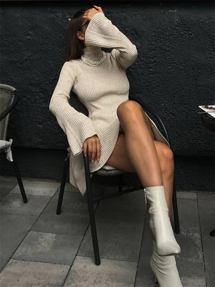 Upgrade your wardrobe with our Robe Kristina! This elegant knitted A-line mini sweater dress boasts a sexy turtleneck and flared sleeves. Perfect for any occasion, this dress will have you feeling confident and stylish. Stay warm and chic this season with our Robe Kristina.