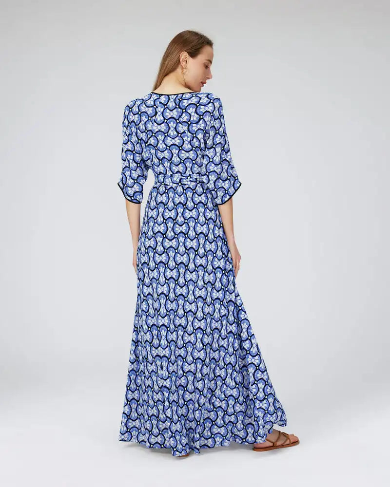 Indulge in a luxurious fashion experience with our Danica Robe. This French-inspired, mid-length dress boasts a personalized, original print that exudes style and sophistication. The split design adds a unique touch, making it a must-have for any fashionista. Elevate your wardrobe with this elegant and exclusive piece.